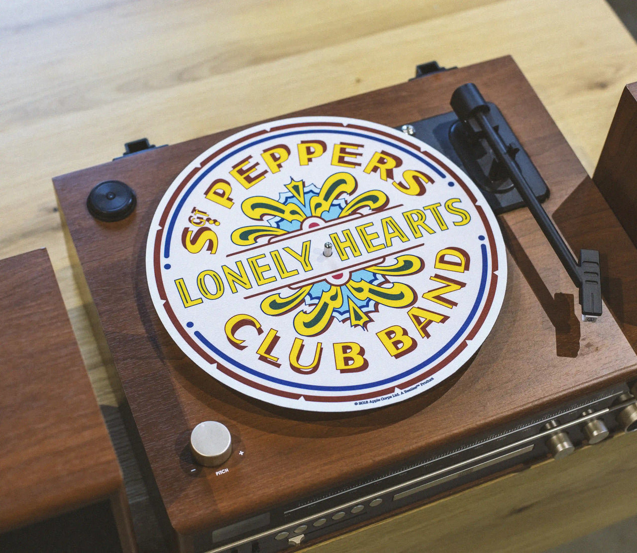 Crosley Beatles Sgt Pepper white slip mat displayed in lifestyle setting for vinyl record player