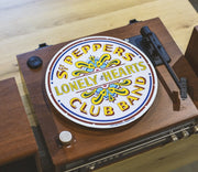 Crosley Beatles Sgt Pepper white slip mat displayed in lifestyle setting for vinyl record player