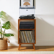 Crosley Asheville walnut record player stand with vinyl storage in a home entertainment setting