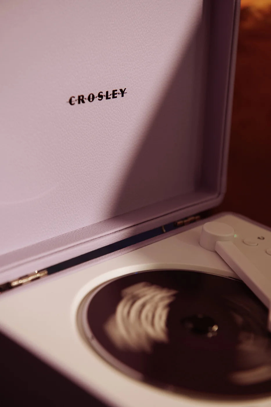 Crosley Cruiser CD Player in lavender, detail view showing device controls and features