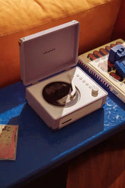 Lavender Crosley Cruiser CD player displayed in a lifestyle setting