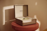 Crosley Voyager CD player with Bluetooth and FM radio in dune color displayed in lifestyle setting