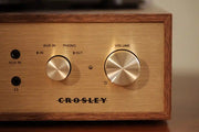Crosley Miles Bluetooth Record Player in walnut wood with detailed view of turntable controls and finish