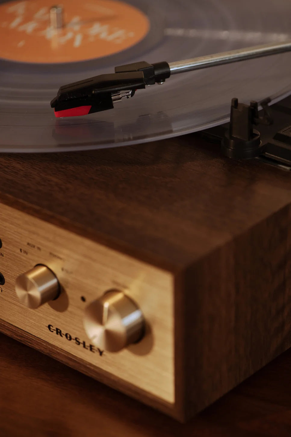 Crosley Miles Bluetooth Record Player in walnut finish, detail view showing wood grain and control panel