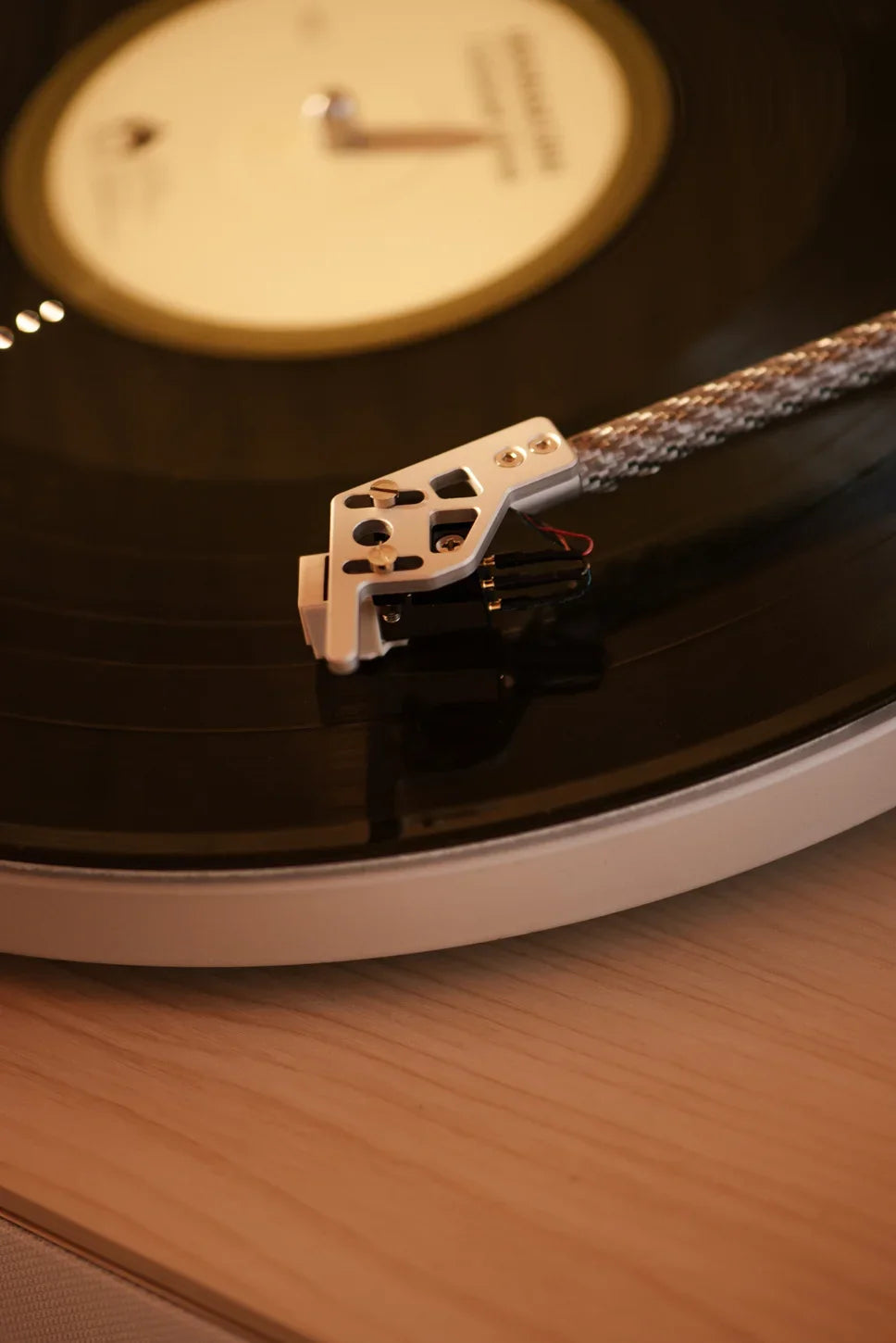Crosley Stave natural wood Bluetooth record player displayed in a home setting