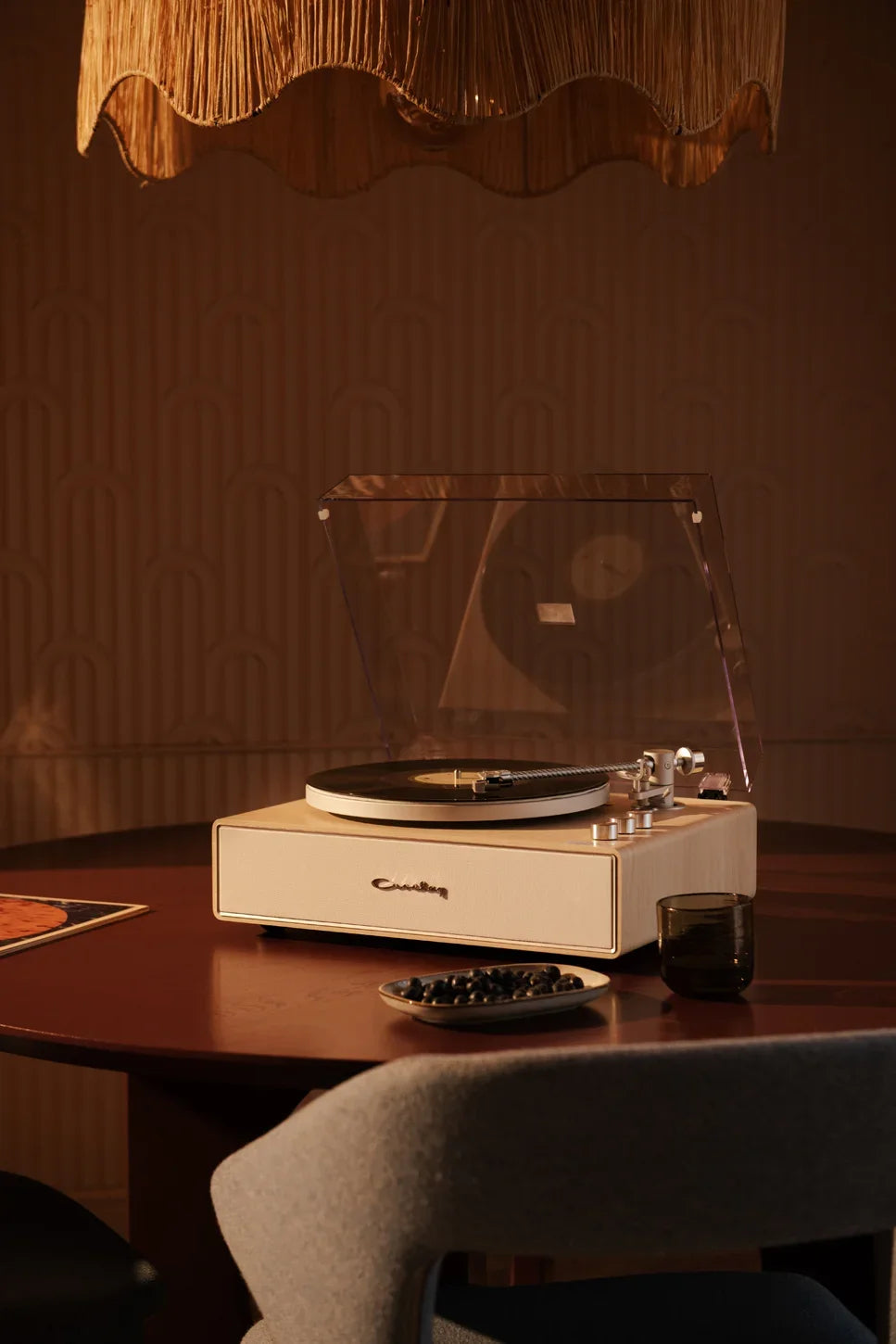Crosley Stave Bluetooth Record Player in natural wood finish displayed in lifestyle setting