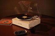 Crosley Stave Bluetooth Record Player in natural finish displayed in lifestyle setting