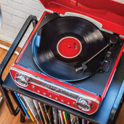 Crosley Powel 7-in-1 red record player displayed in a lifestyle setting