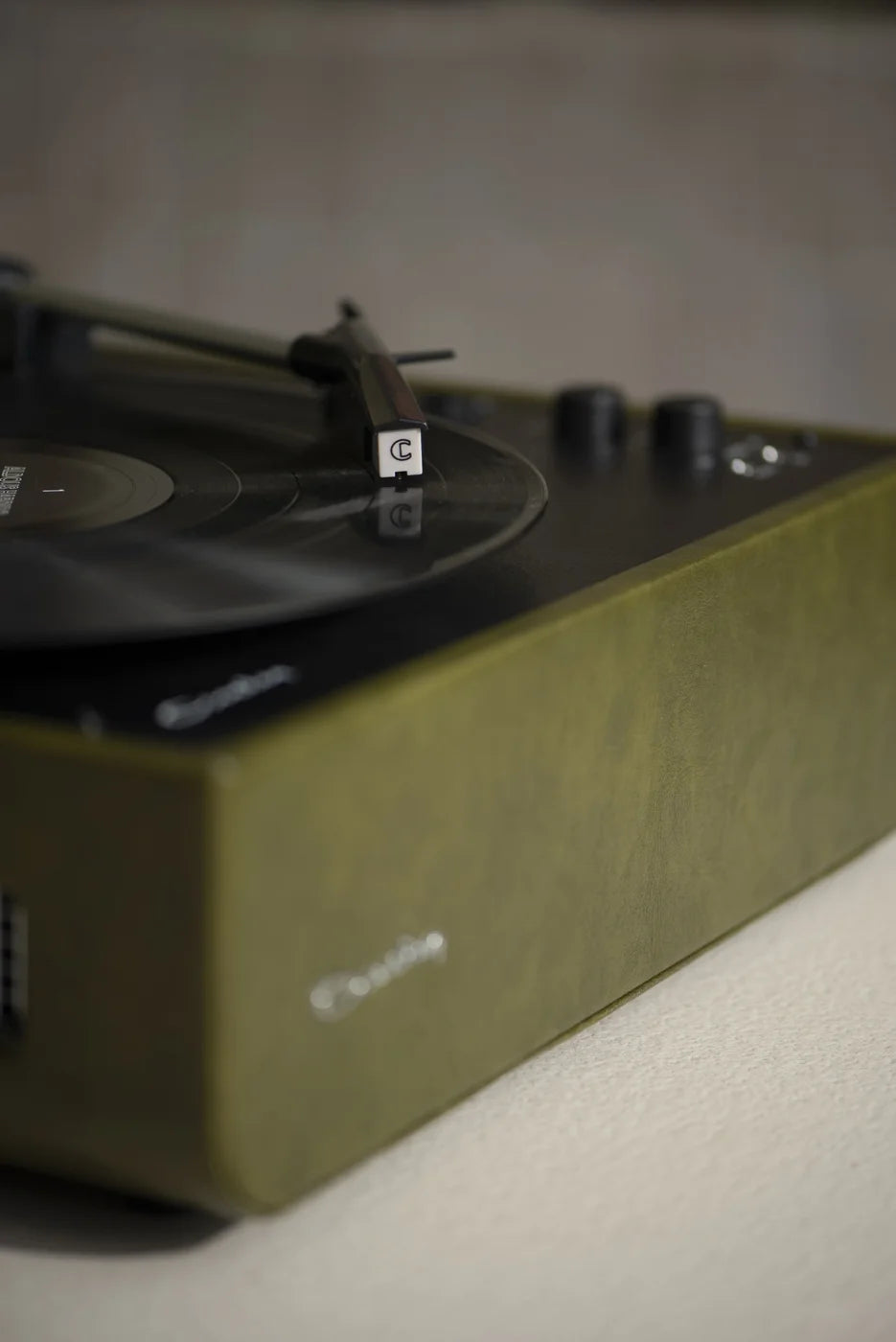 Crosley Mercury Bluetooth Vinyl Record Player in Forest Green, detailed view of turntable controls and design