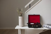 Crosley Cruiser Plus Bluetooth Record Player in black displayed in a lifestyle setting
