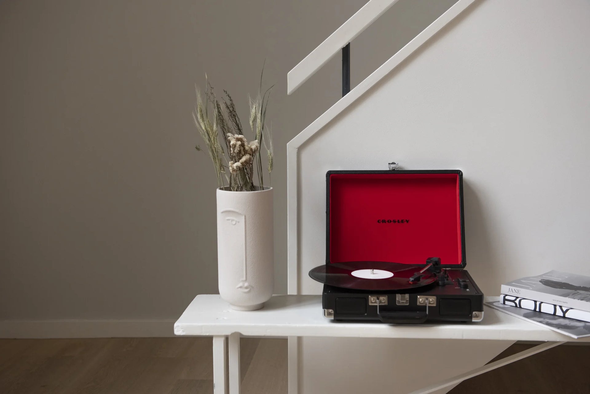 Crosley Cruiser Plus Bluetooth Record Player in black displayed in a lifestyle setting