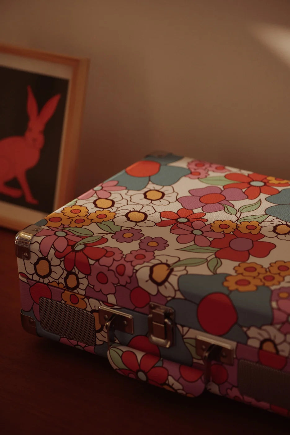 Crosley Cruiser Plus Bluetooth Record Player in floral design, showing decorative details