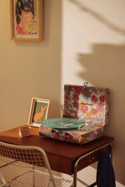 Crosley Cruiser Plus Bluetooth Record Player in floral pattern displayed in a lifestyle setting