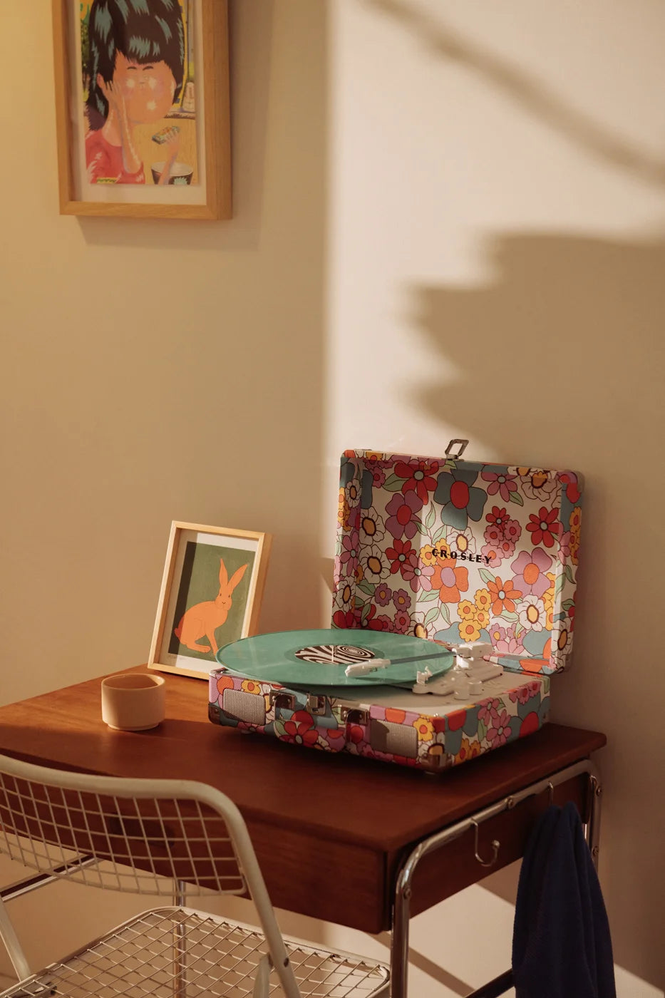 Crosley Cruiser Plus Bluetooth Record Player in floral pattern displayed in a lifestyle setting