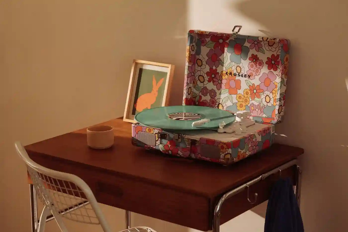 Crosley Cruiser Plus floral Bluetooth record player displayed in lifestyle setting