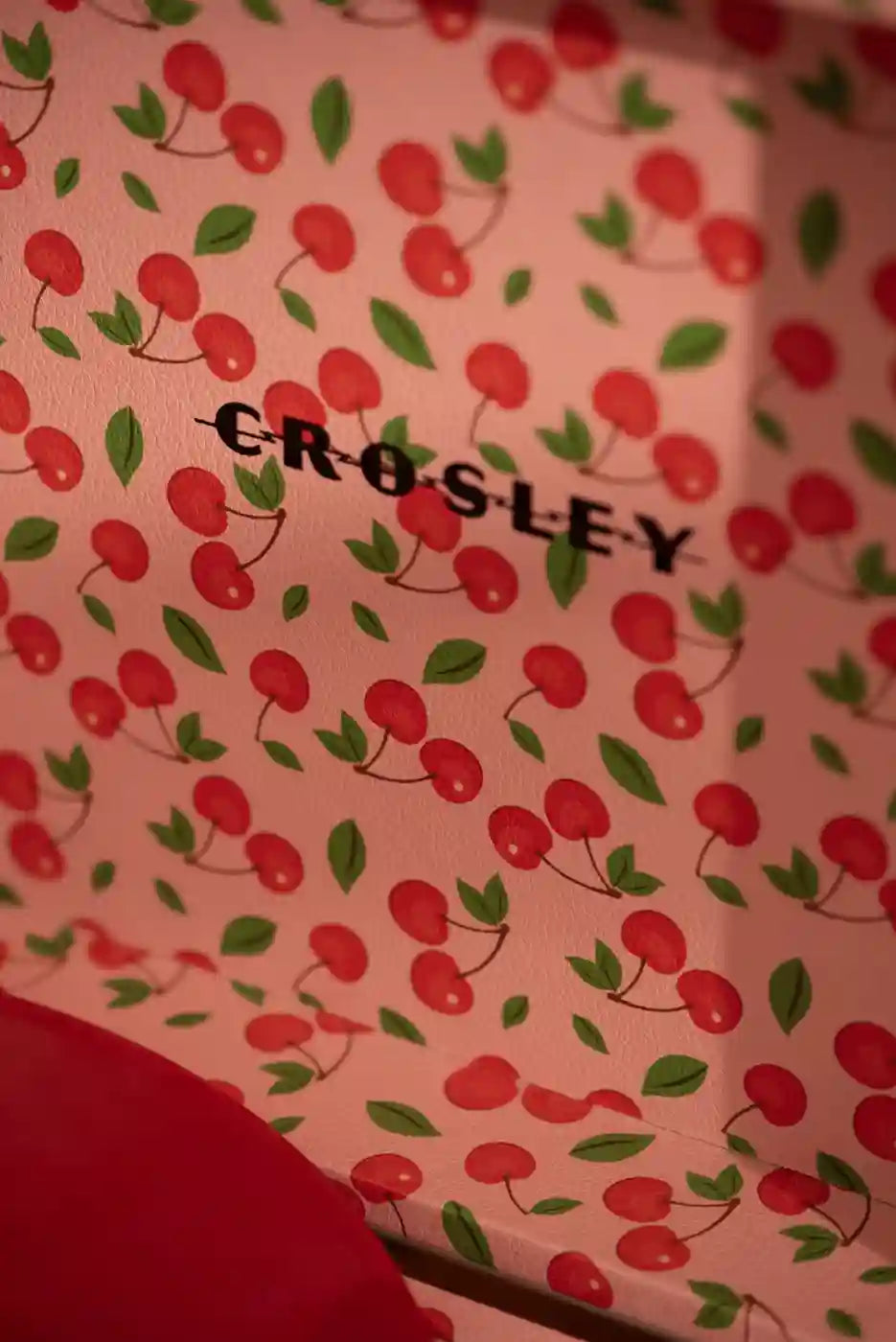 Crosley Cruiser Plus Bluetooth Record Player in red, detail view of turntable controls and design