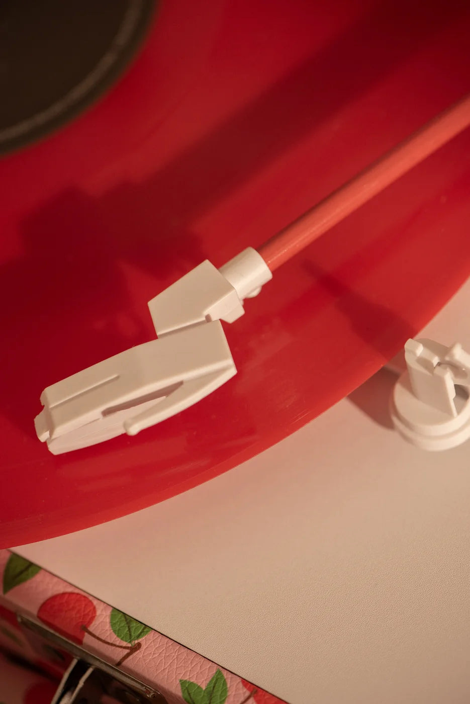 Crosley Cruiser Plus Bluetooth record player in red, detailed close-up view of turntable