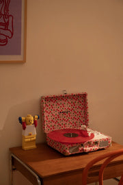 Red Crosley Cruiser Plus Bluetooth record player displayed in lifestyle setting