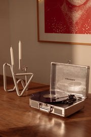 Silver Crosley Cruiser Plus Bluetooth record player displayed in lifestyle setting
