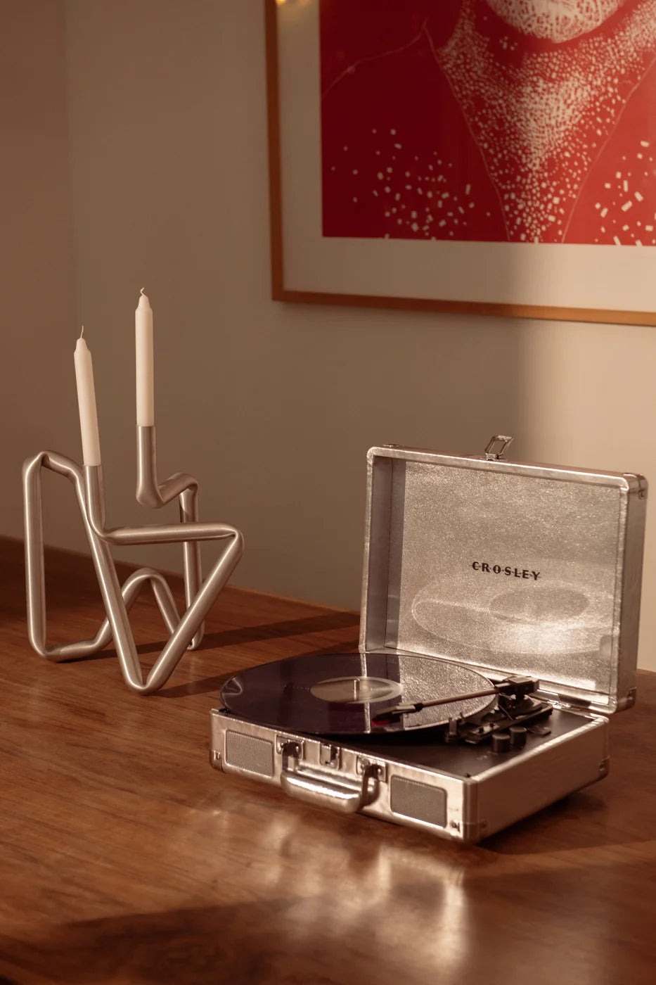 Silver Crosley Cruiser Plus Bluetooth record player displayed in lifestyle setting