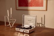 Crosley Cruiser Plus silver Bluetooth record player displayed in a lifestyle setting