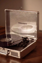 Crosley Cruiser Plus Bluetooth record player in silver displayed in a lifestyle setting