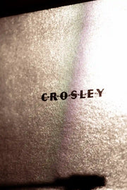 Crosley Cruiser Plus Bluetooth Record Player in silver displayed in a lifestyle setting