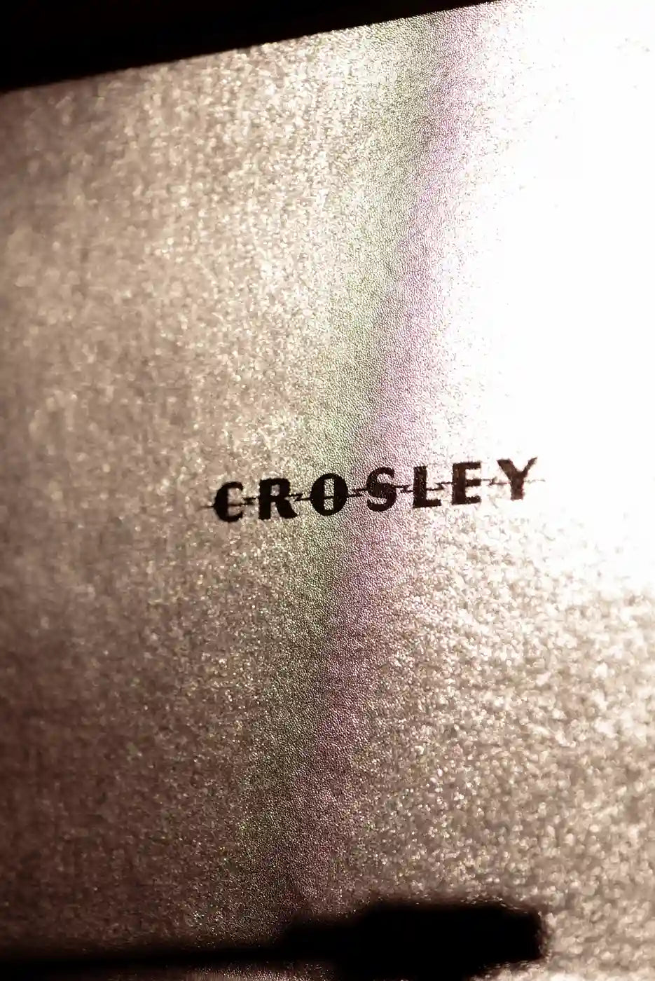 Crosley Cruiser Plus Bluetooth Record Player in silver displayed in a lifestyle setting