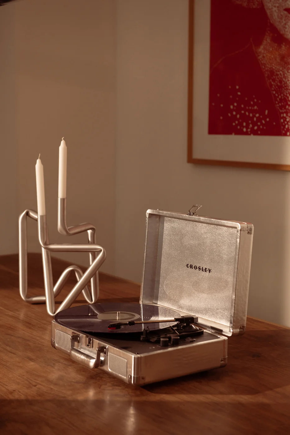 Crosley Cruiser Plus Bluetooth record player in silver displayed in a lifestyle setting