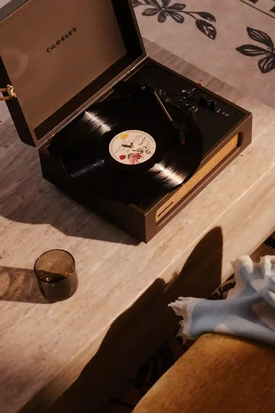 Crosley Voyager Bluetooth Record Player in Cocao brown displayed in a lifestyle setting