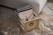 Crosley natural wood vinyl record storage crate with front-facing view showing open wooden design for album organization