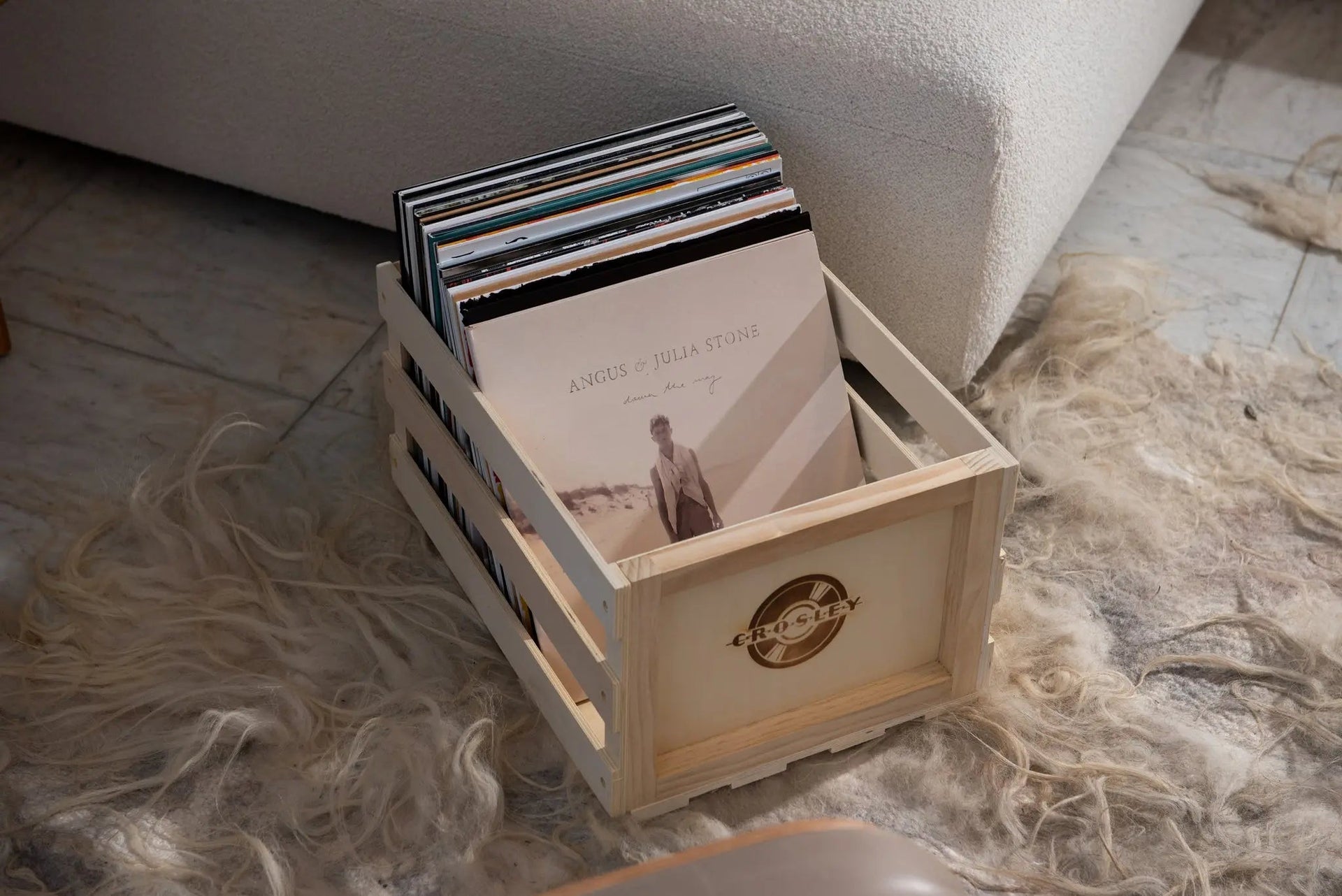 Crosley natural wood vinyl record storage crate with front-facing view showing open wooden design for album organization