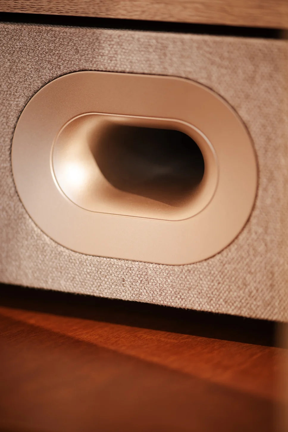 Crosley E100 record player in natural light grey, speaker detail