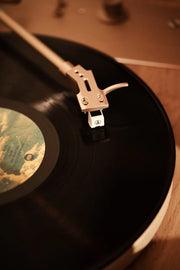 Crosley E100 record player in natural light grey, arm and needle detail
